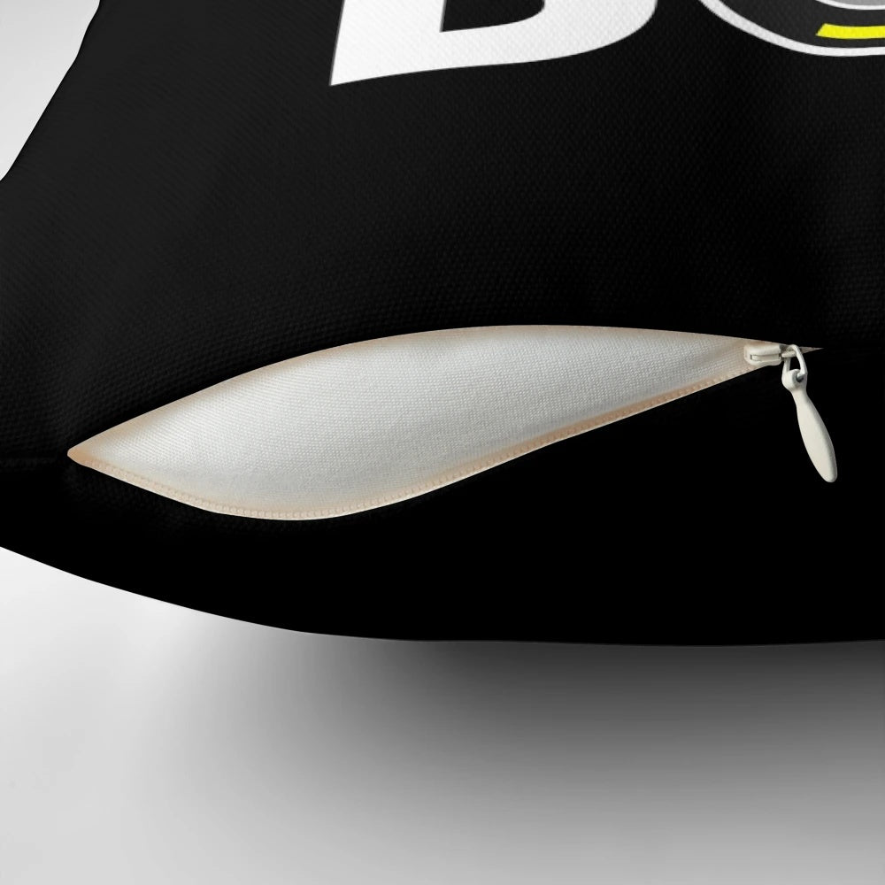 A white pillow with a bold, monochrome design inspired by formula 1 tires and race car culture.
