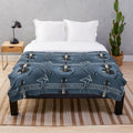 Music-themed plush blanket featuring a band logo design