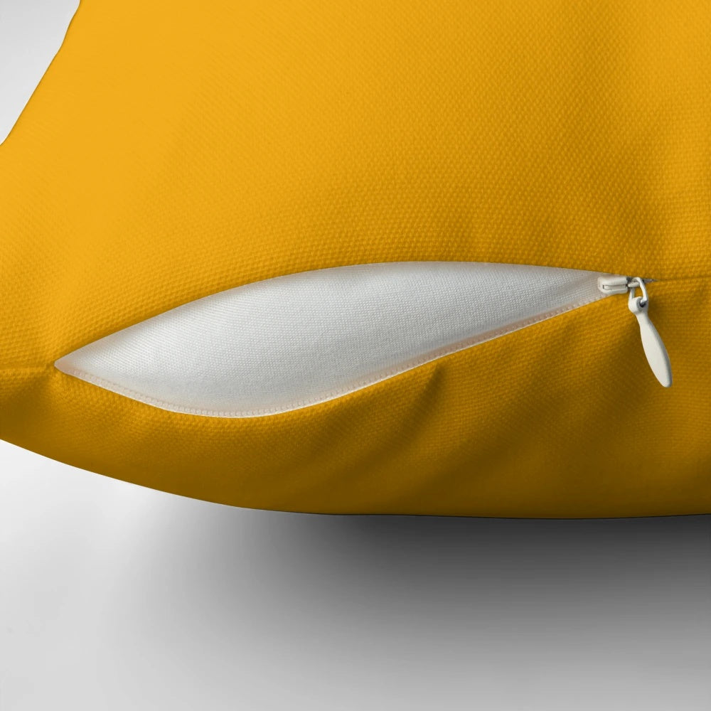 Mustard yellow decorative pillow with a minimalist, modern design