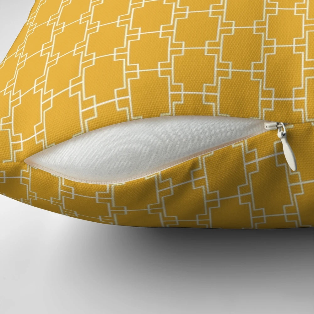Mustard yellow pillow with geometric square pattern in a mid-century modern style