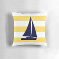 A decorative navy blue and mustard yellow striped pillow with a sailboat design, perfect for coastal or nautical-themed home decor.