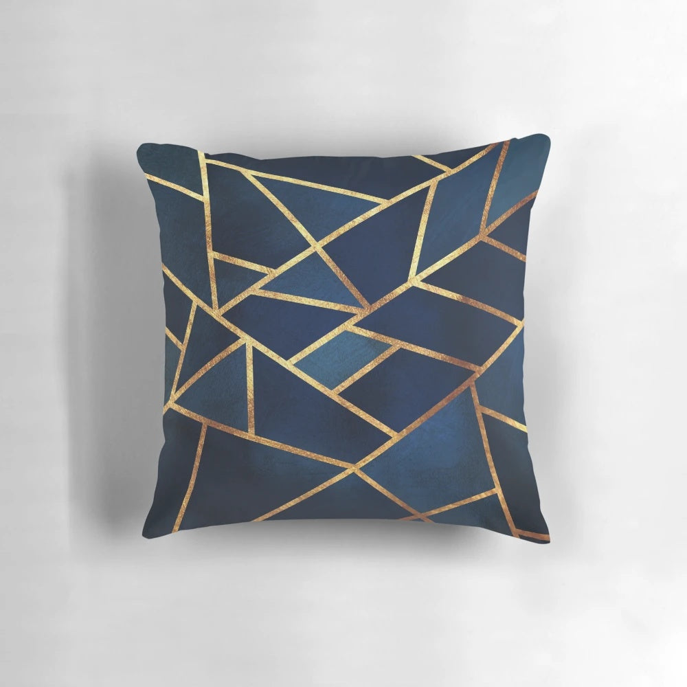 Navy and gold geometric throw pillow with abstract triangular design