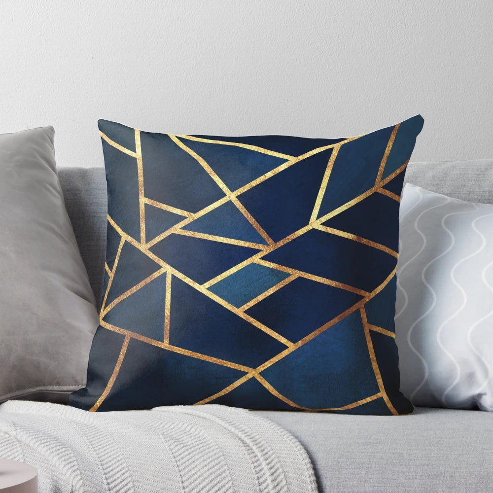 Navy and gold geometric throw pillow with abstract triangular design
