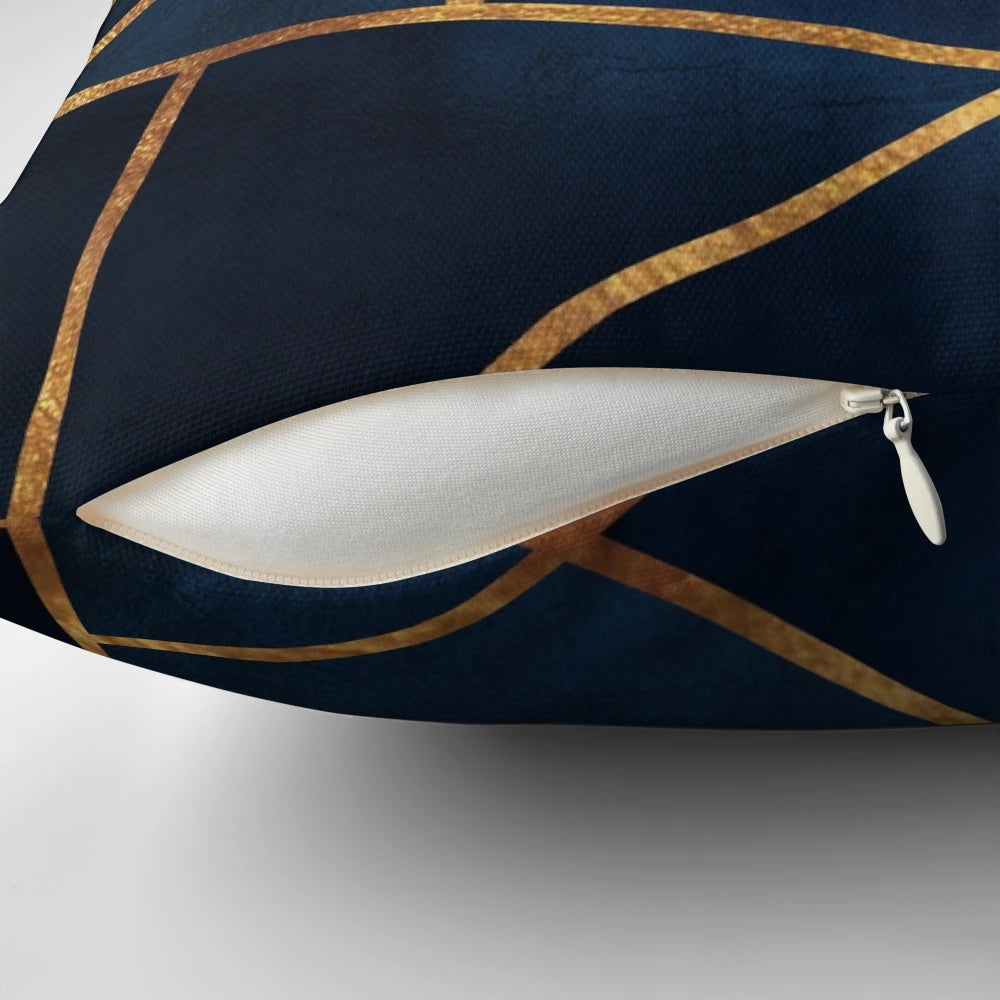 Navy and gold geometric throw pillow with abstract triangular design