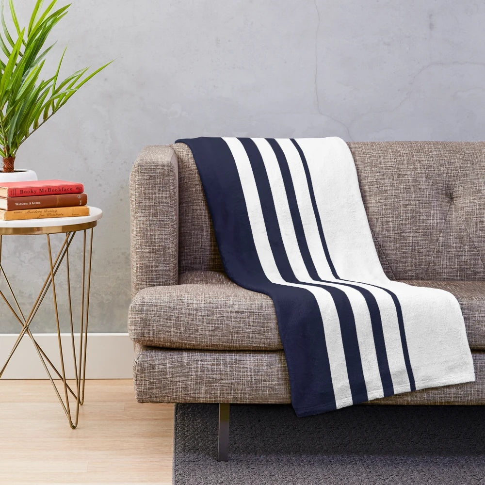 Navy and white striped plush blanket with a modern, minimalist design