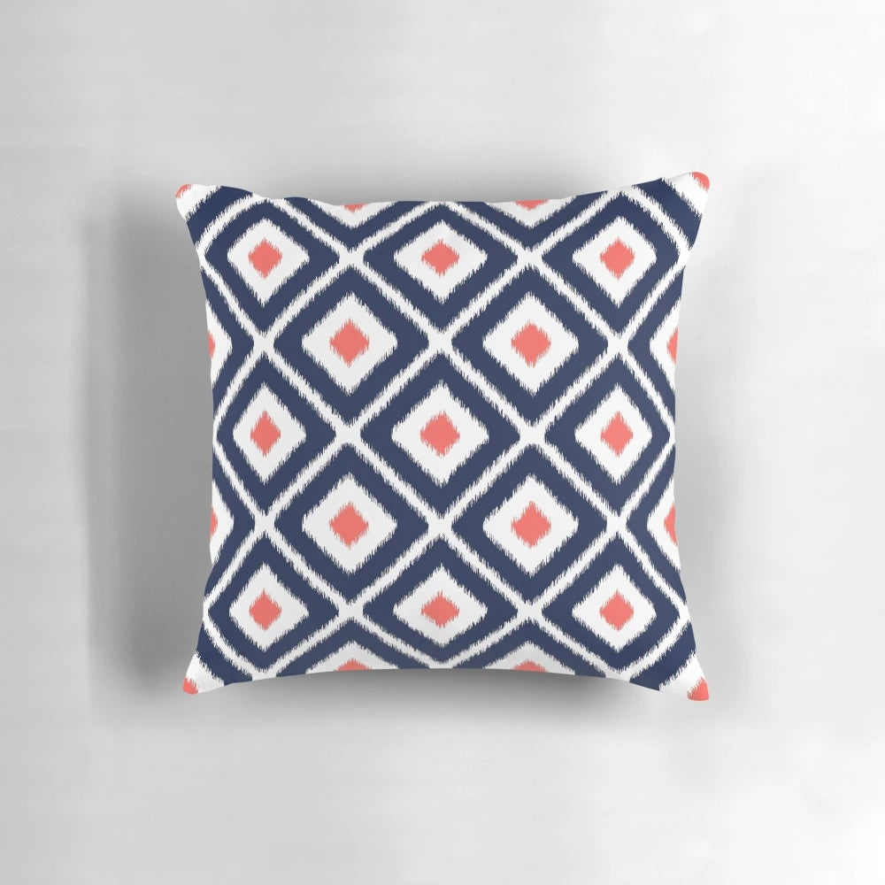 Navy blue and coral ikat diamond pattern decorative throw pillow