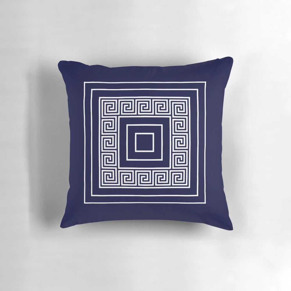 Navy blue pillow with a Greek key meander pattern and framed squares design