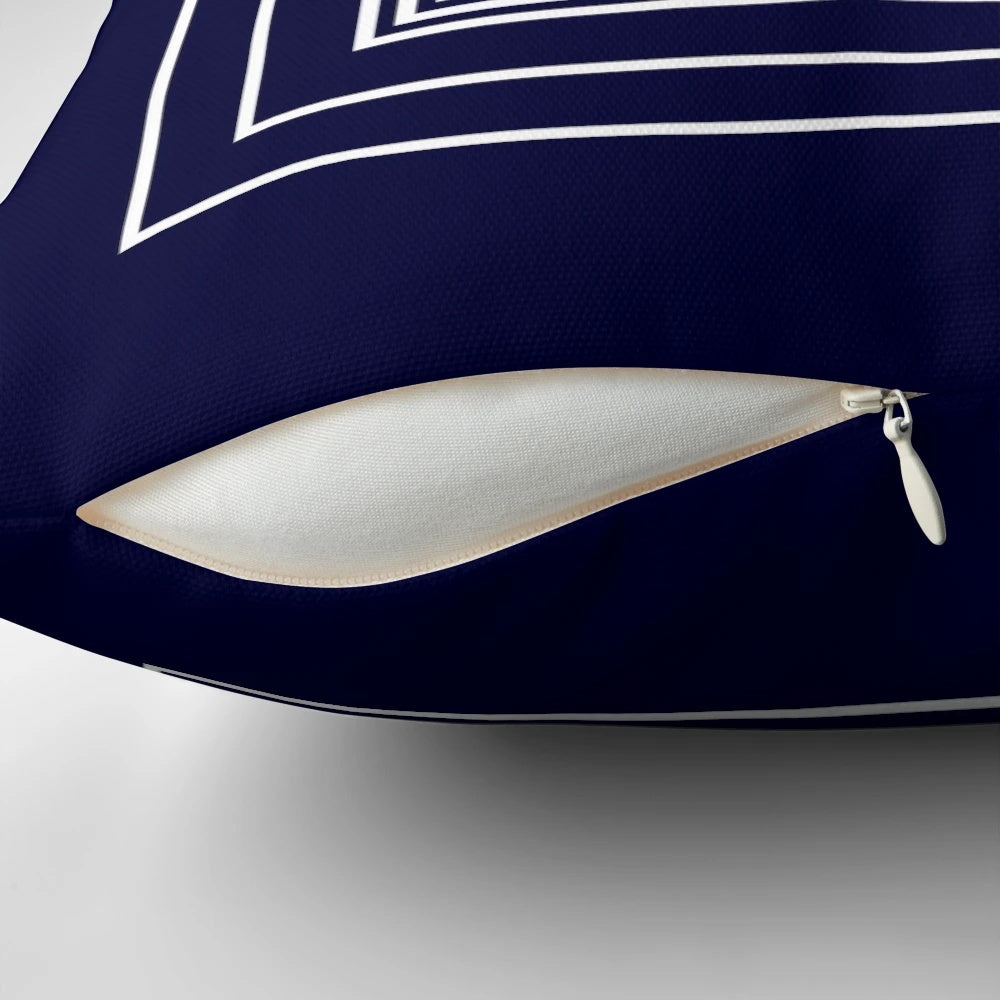 Navy blue pillow with a Greek key meander pattern and framed squares design