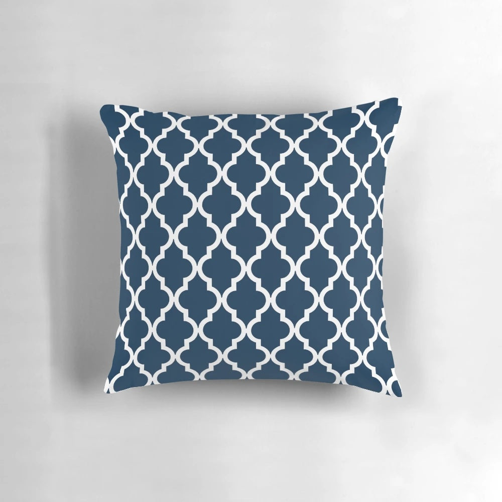 Navy blue pillow with a Moroccan quatrefoil design, perfect for modern home decor.