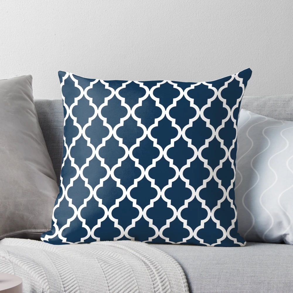 Navy blue pillow with a Moroccan quatrefoil design, perfect for modern home decor.