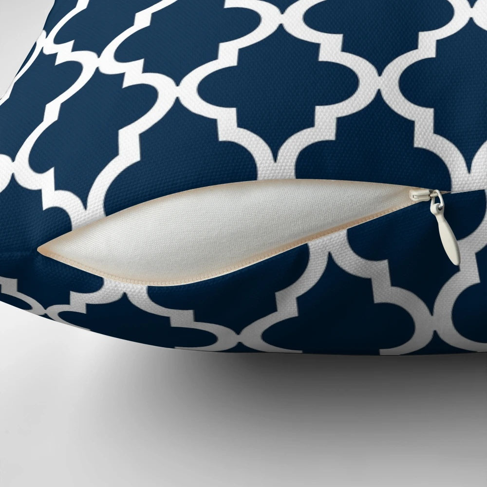 Navy blue pillow with a Moroccan quatrefoil design, perfect for modern home decor.