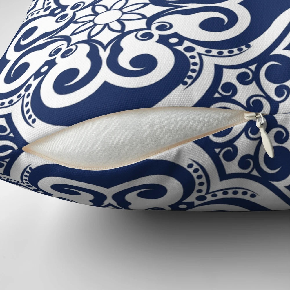 Navy blue pillow with a modern Moroccan tile pattern, perfect for adding a touch of classic style to any room.