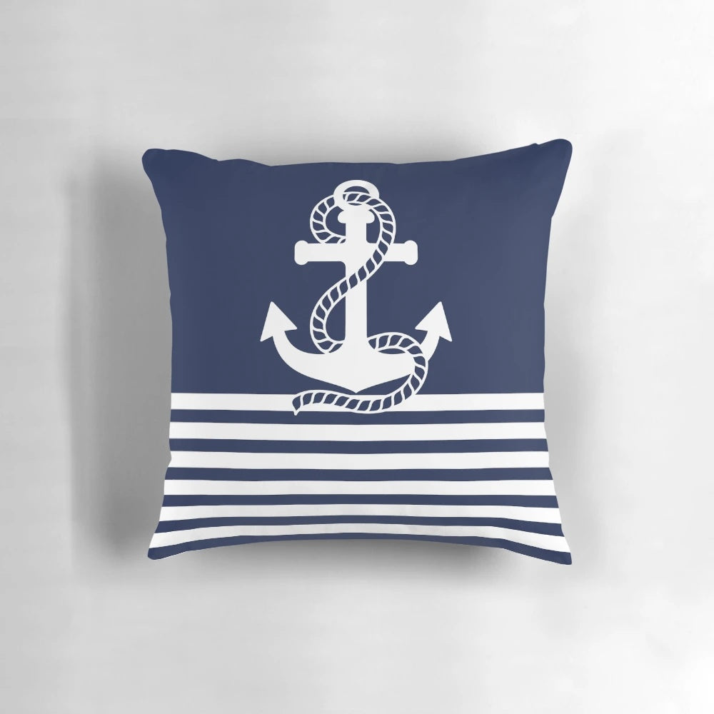 Navy blue and white striped pillow with anchor design