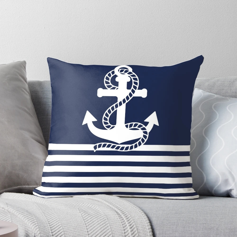 Navy blue and white striped pillow with anchor design