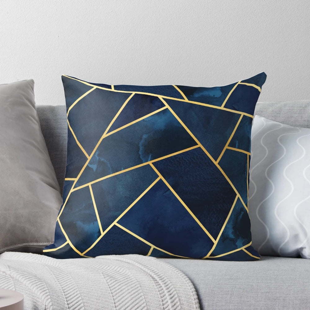 Navy and gold geometric patterned decorative throw pillow