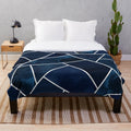 Navy and white geometric pattern plush blanket