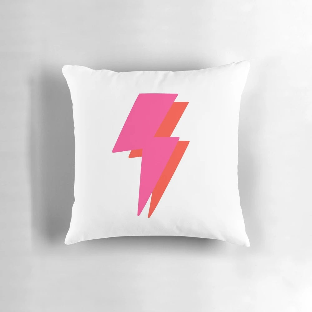 Vibrant neon lightning bolt design on a plush throw pillow for a modern, aesthetic home accent.