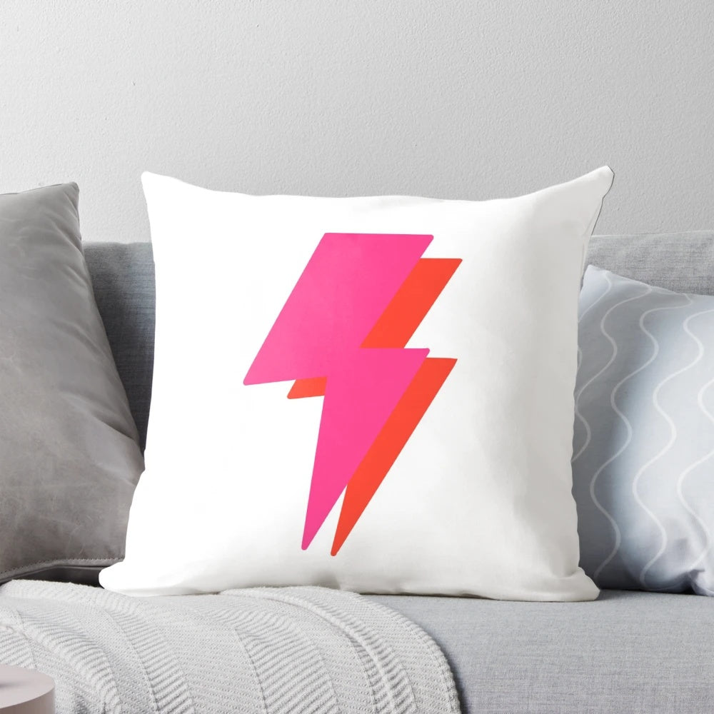 Vibrant neon lightning bolt design on a plush throw pillow for a modern, aesthetic home accent.