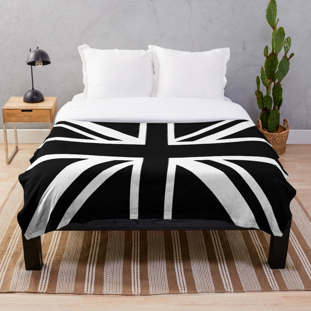 Newcastle United plush blanket featuring black and white stripes and a Union Jack flag design
