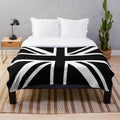 Newcastle United plush blanket featuring black and white stripes and a Union Jack flag design