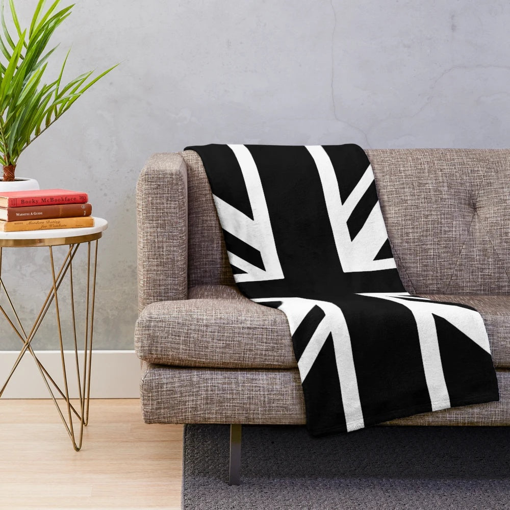 Newcastle United plush blanket featuring black and white stripes and a Union Jack flag design