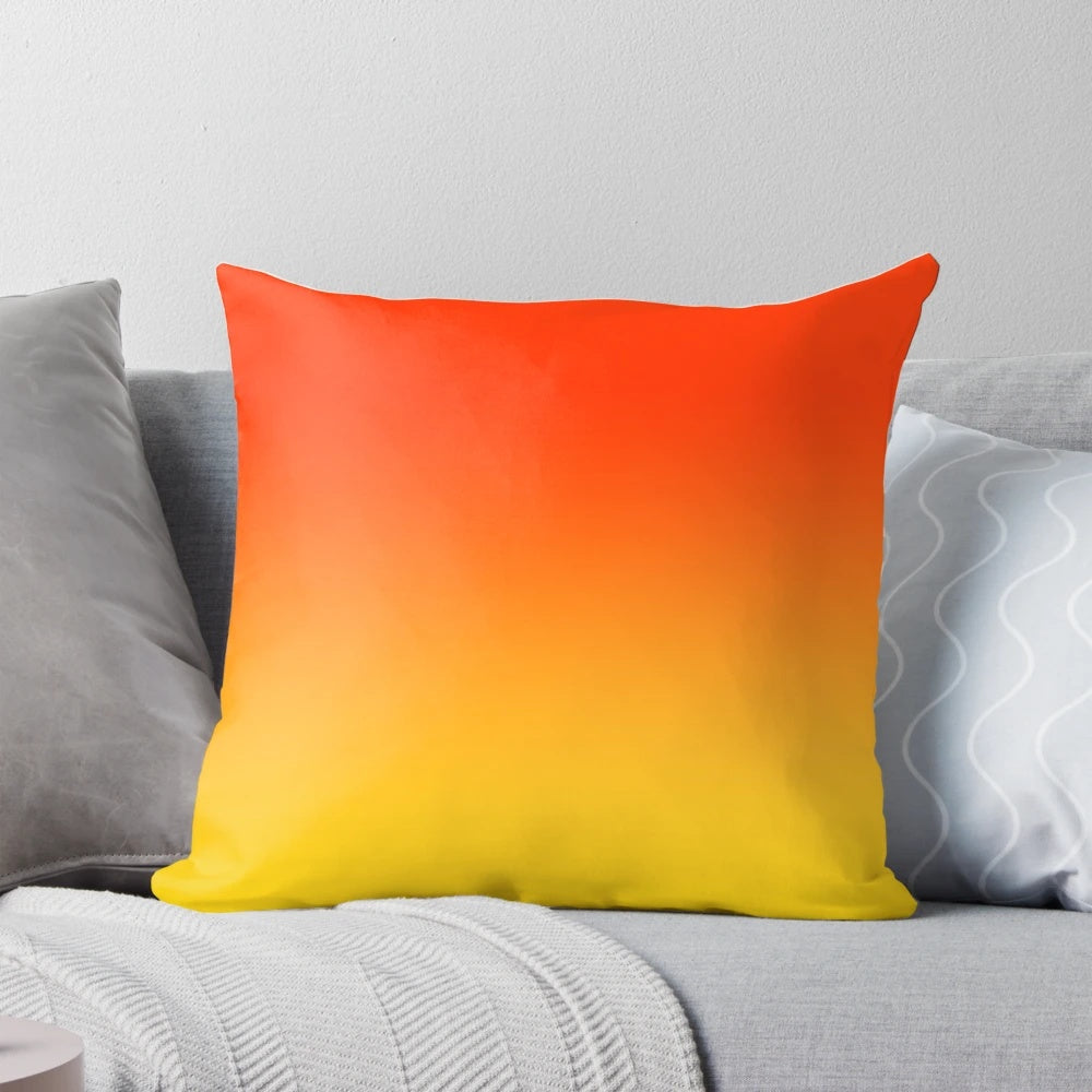 Vibrant ombre gradient pillow in orange, red and yellow tones