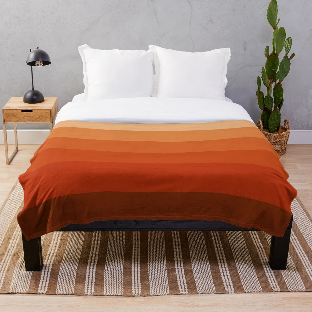 Burnt umber ombre plush blanket with geometric pattern