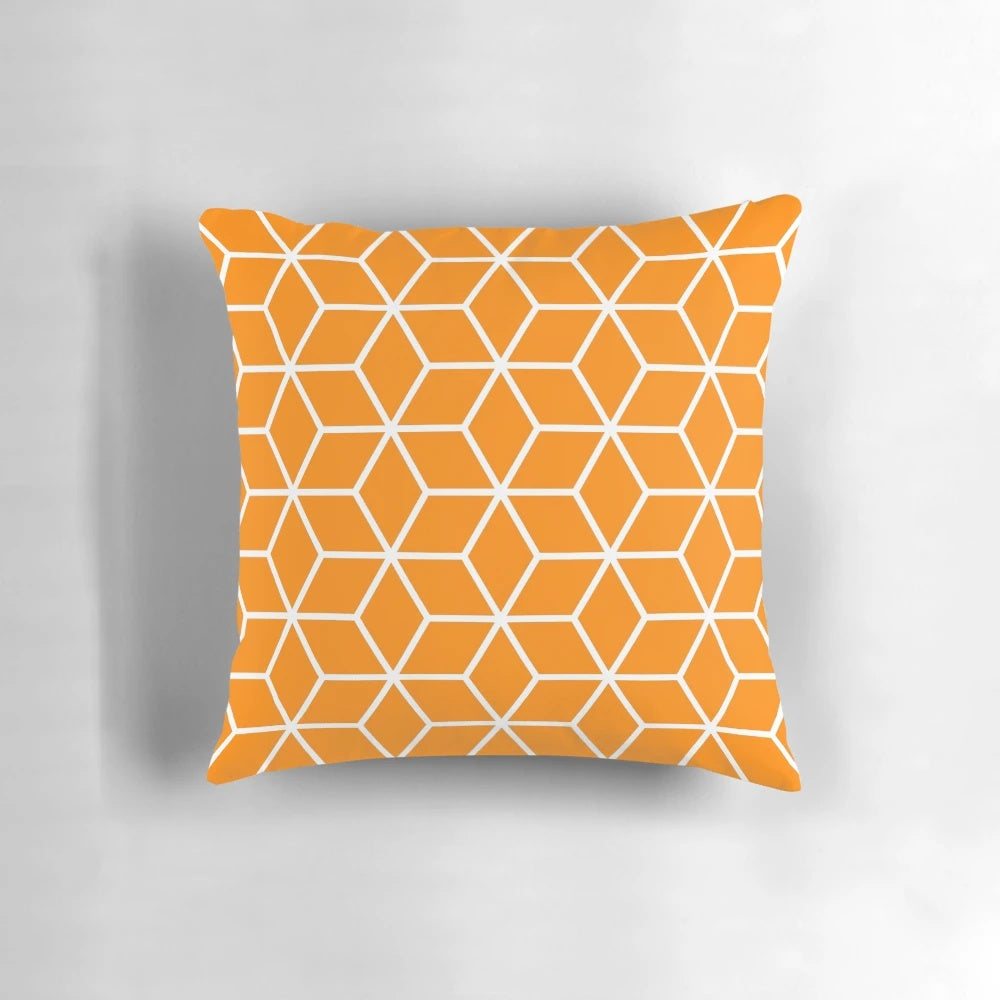 An orange, geometric, honeycomb-patterned pillow with an interlocked, lattice design.