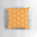 An orange, geometric, honeycomb-patterned pillow with an interlocked, lattice design.