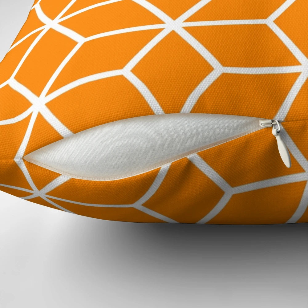 An orange, geometric, honeycomb-patterned pillow with an interlocked, lattice design.