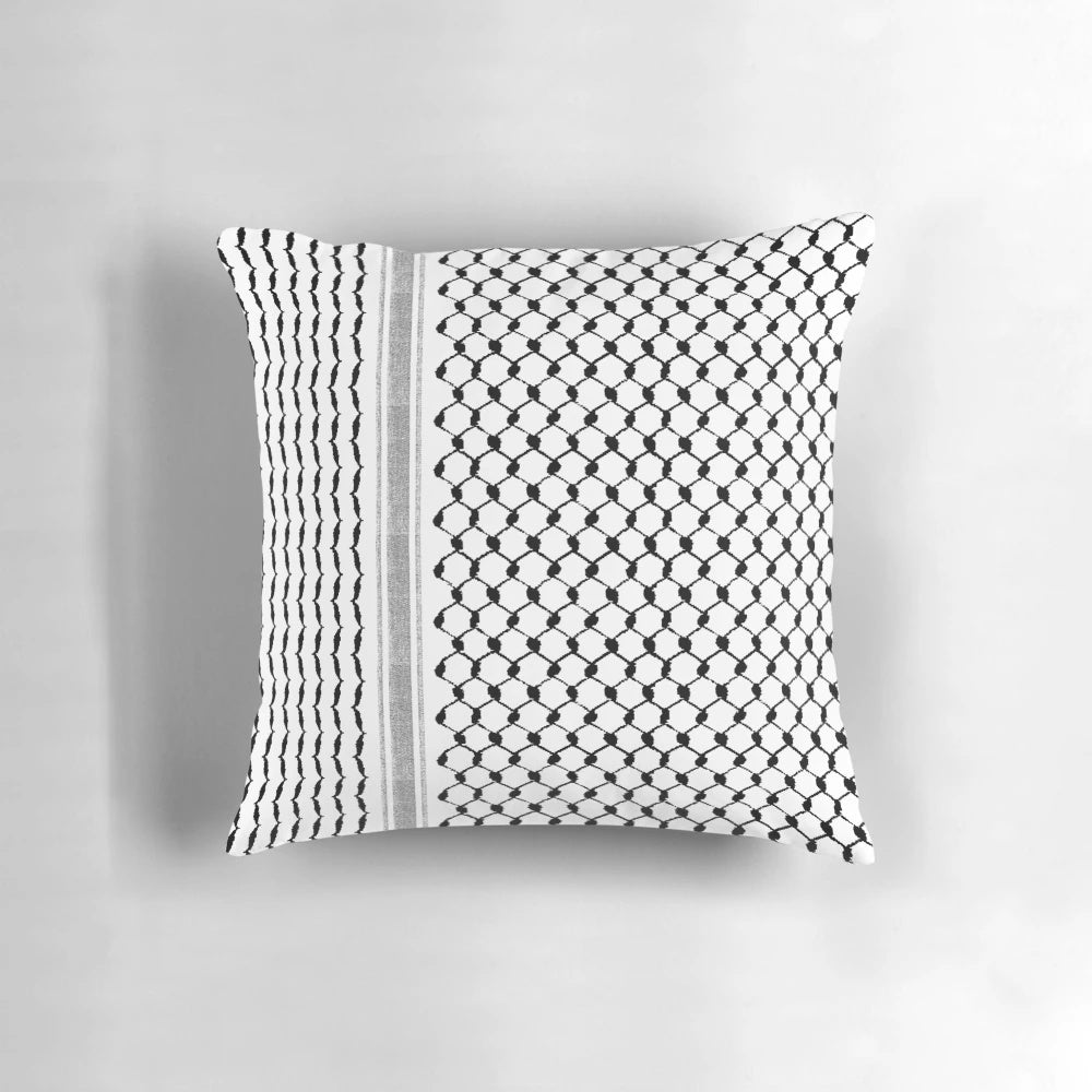 Black and white Palestinian hatta kufiya pattern pillow with traditional keffiyeh design
