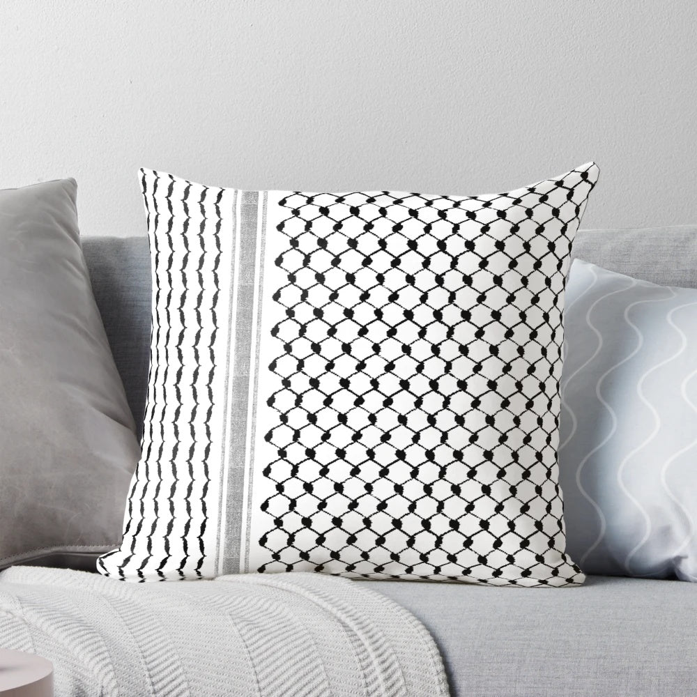 Black and white Palestinian hatta kufiya pattern pillow with traditional keffiyeh design