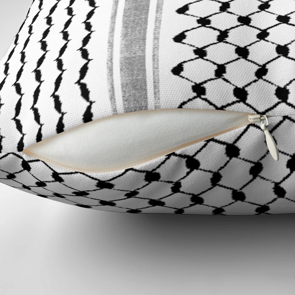 Black and white Palestinian hatta kufiya pattern pillow with traditional keffiyeh design