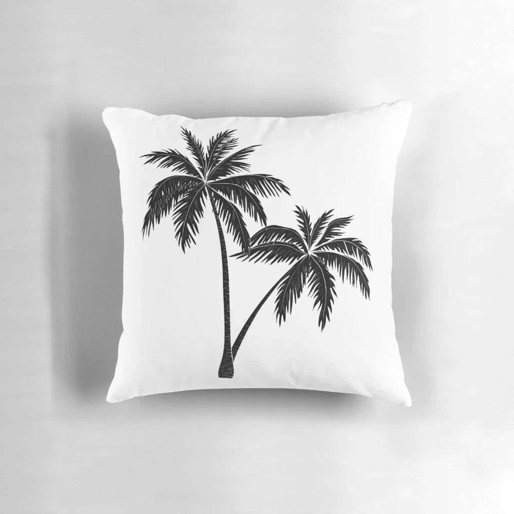 A monochrome palm tree design on a minimalist pillow