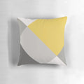Patchwork pillow in mustard yellow and grey colors, featuring a modern, geometric design
