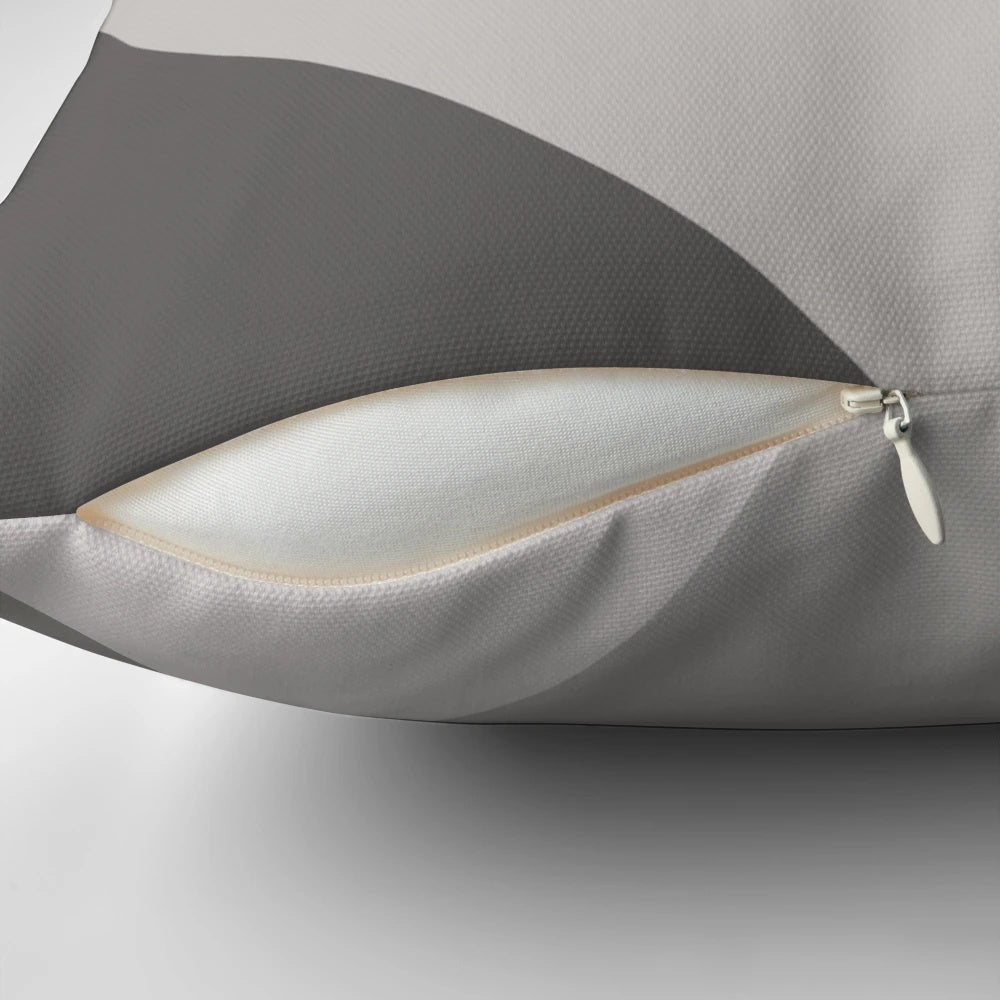 Patchwork pillow in mustard yellow and grey colors, featuring a modern, geometric design
