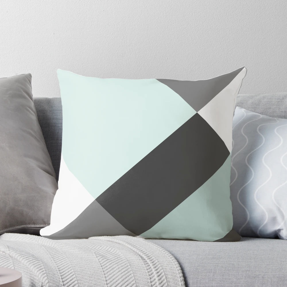 Patchwork pillow in a soothing grey and white color palette, featuring a modern and minimalist design.