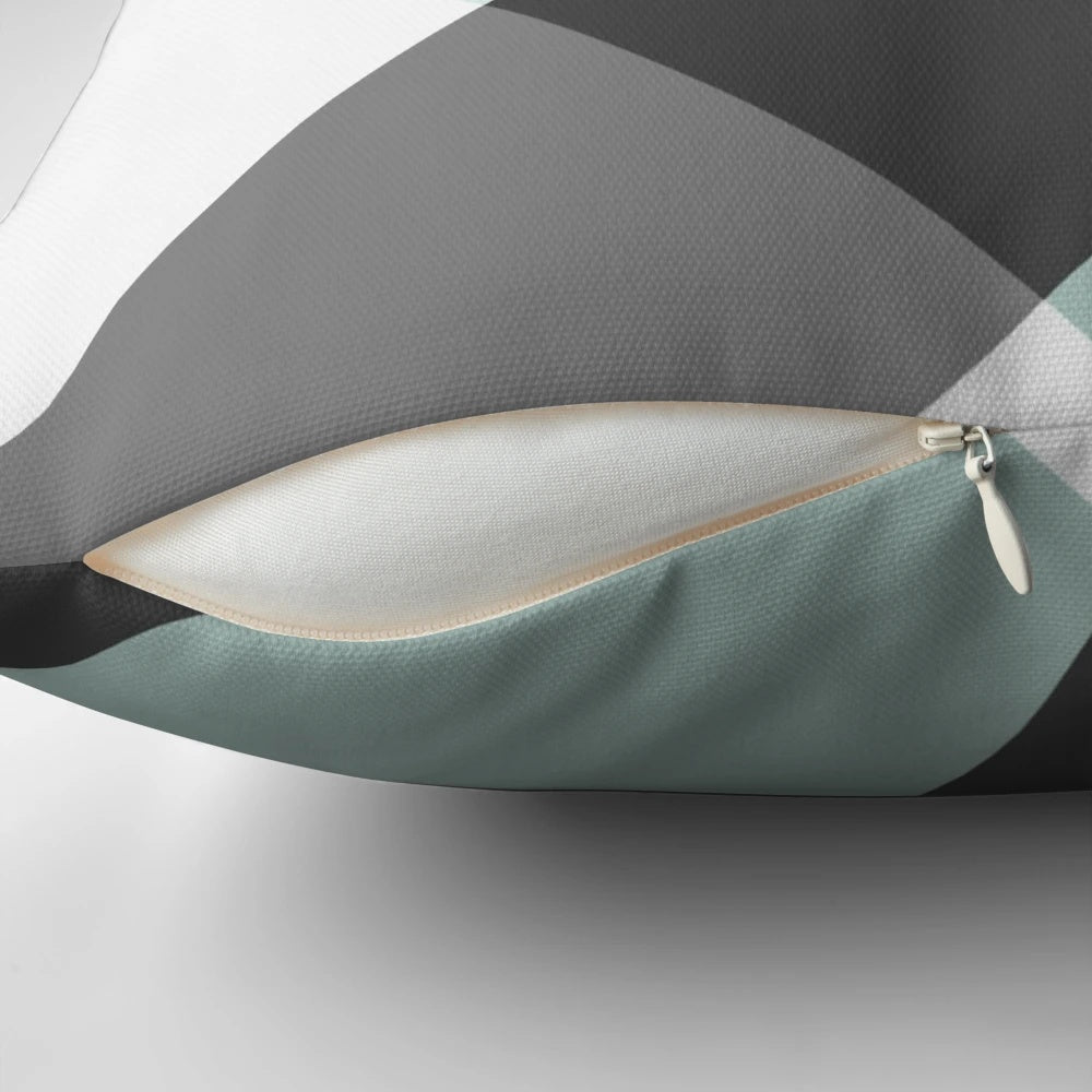 Patchwork pillow in a soothing grey and white color palette, featuring a modern and minimalist design.