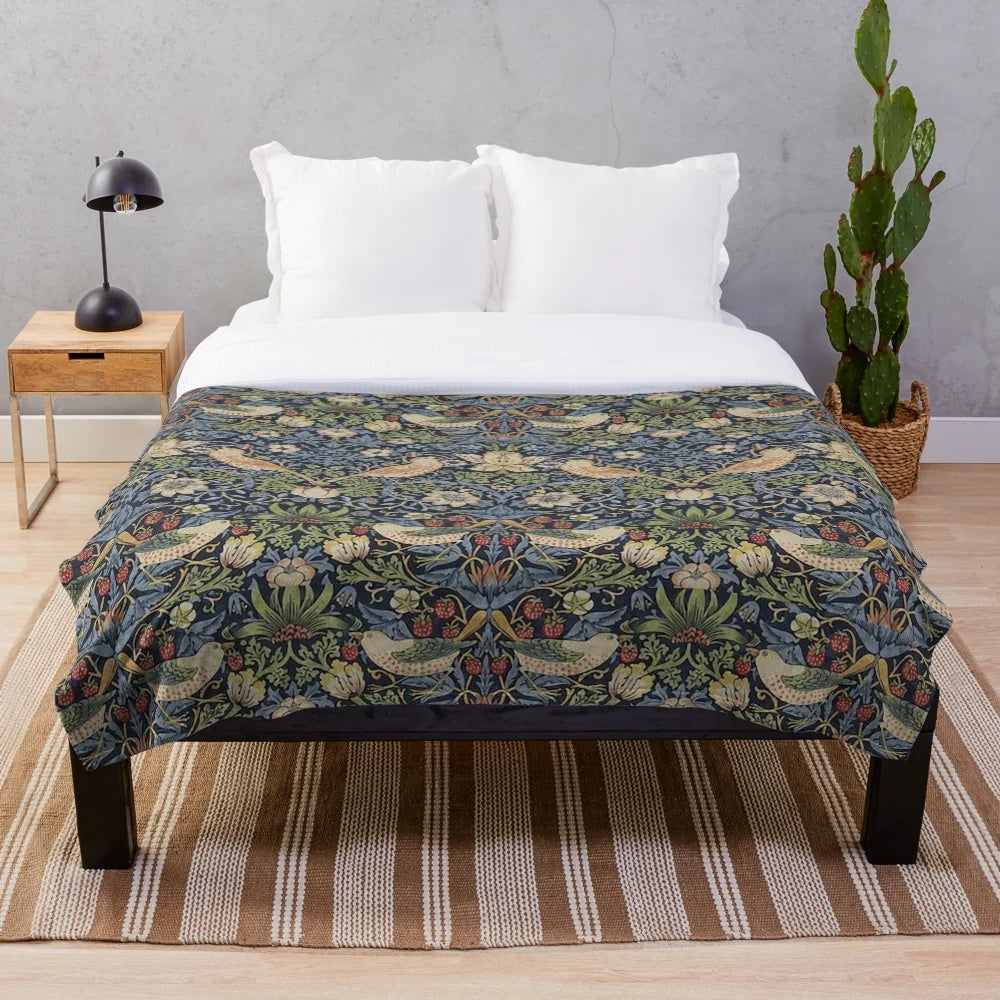 Patterned plush blanket featuring the iconic Strawberry Thief design by renowned British artist William Morris