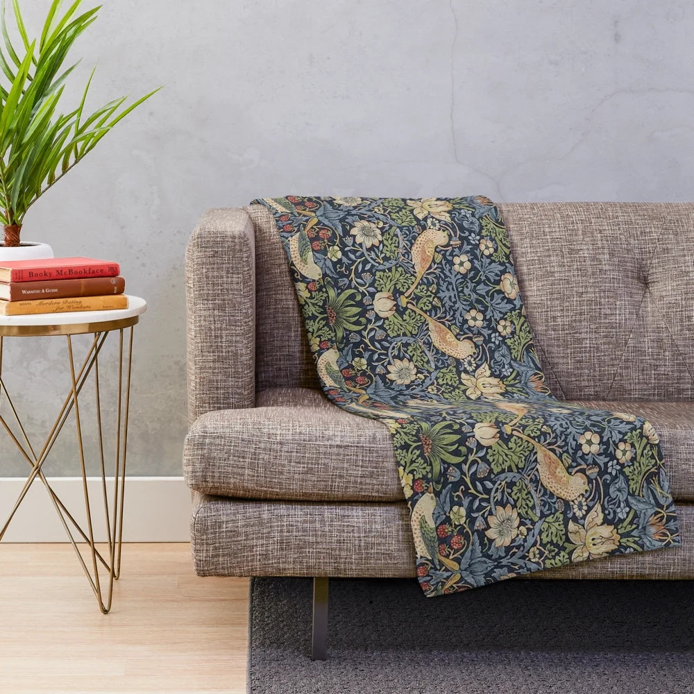Patterned plush blanket featuring the iconic Strawberry Thief design by renowned British artist William Morris