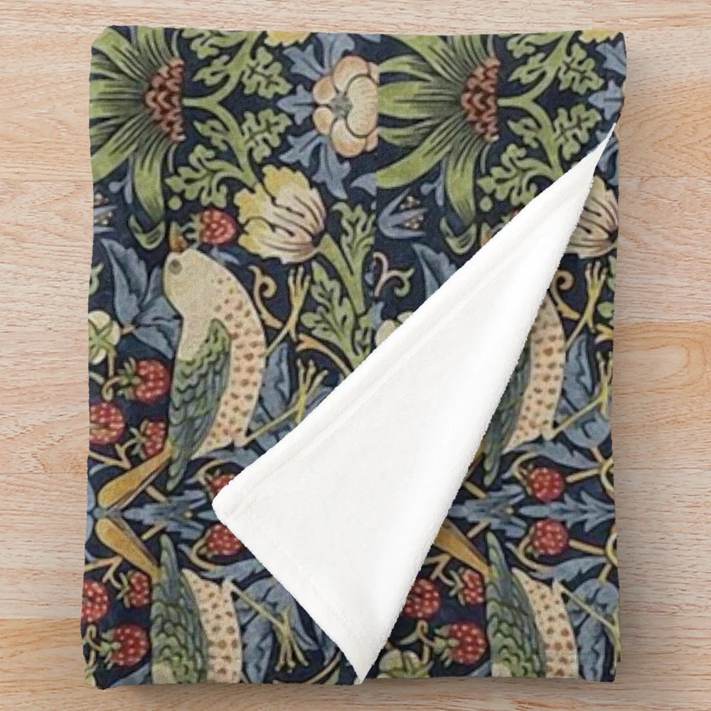 Patterned plush blanket featuring the iconic Strawberry Thief design by renowned British artist William Morris