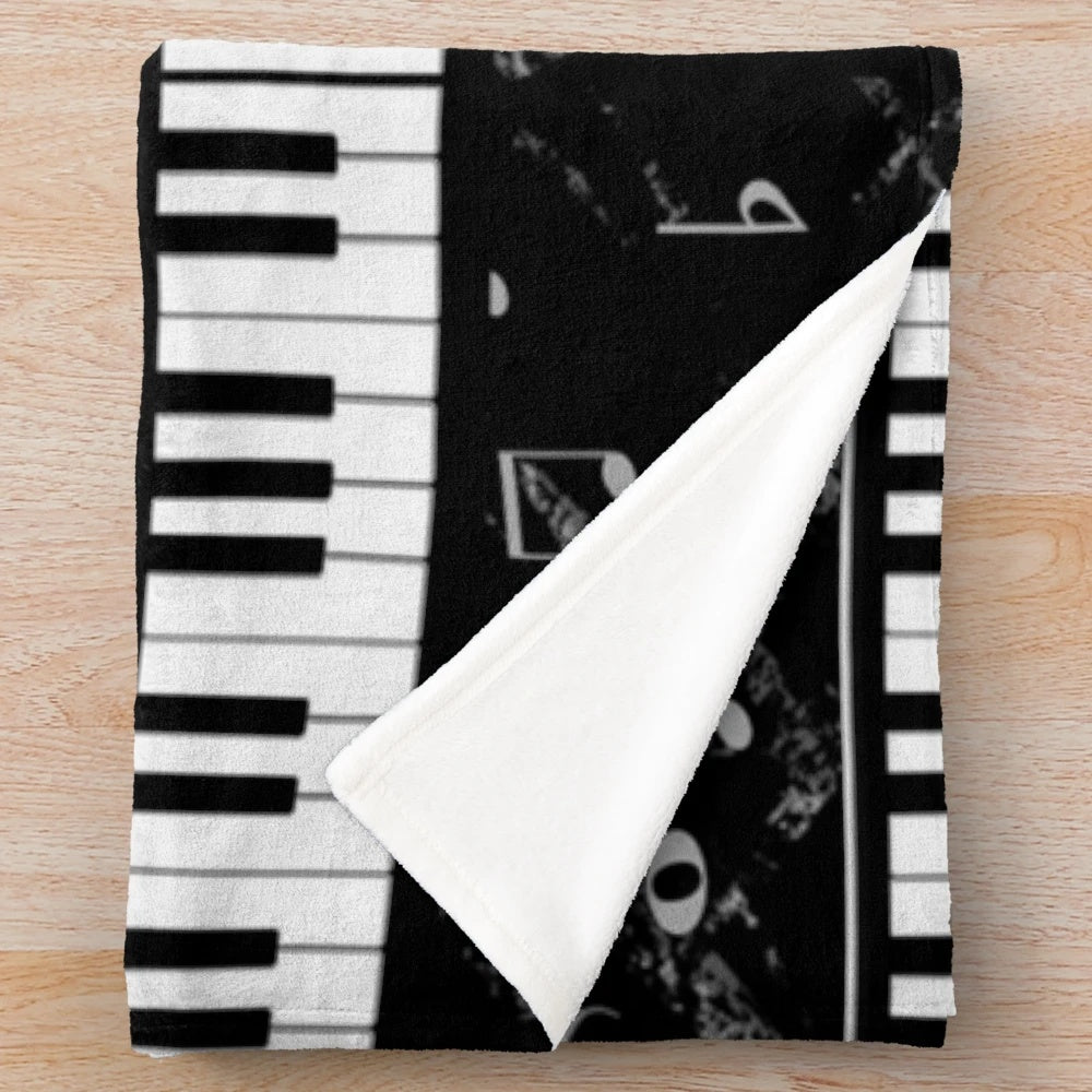 Black and white piano music pattern plush blanket