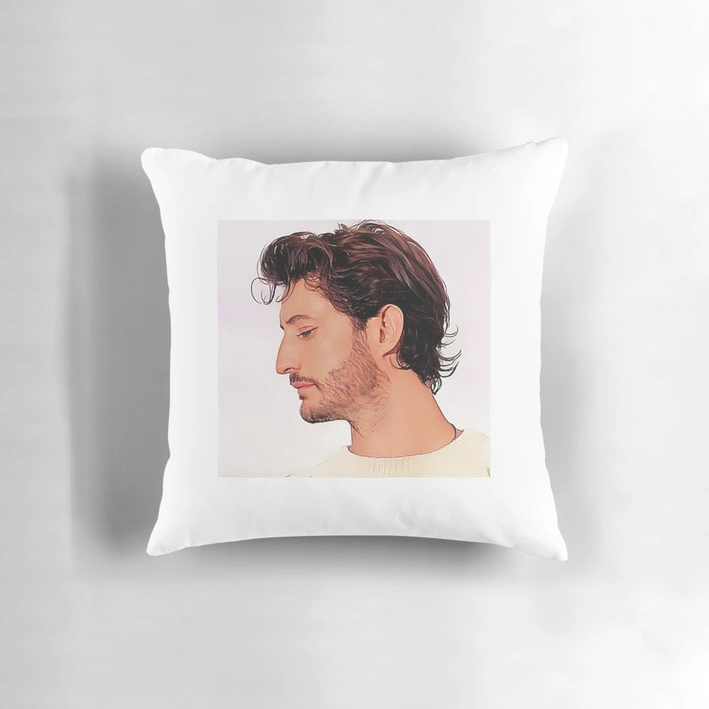 A decorative throw pillow featuring a portrait of French actor Pierre Niney.