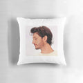 A decorative throw pillow featuring a portrait of French actor Pierre Niney.