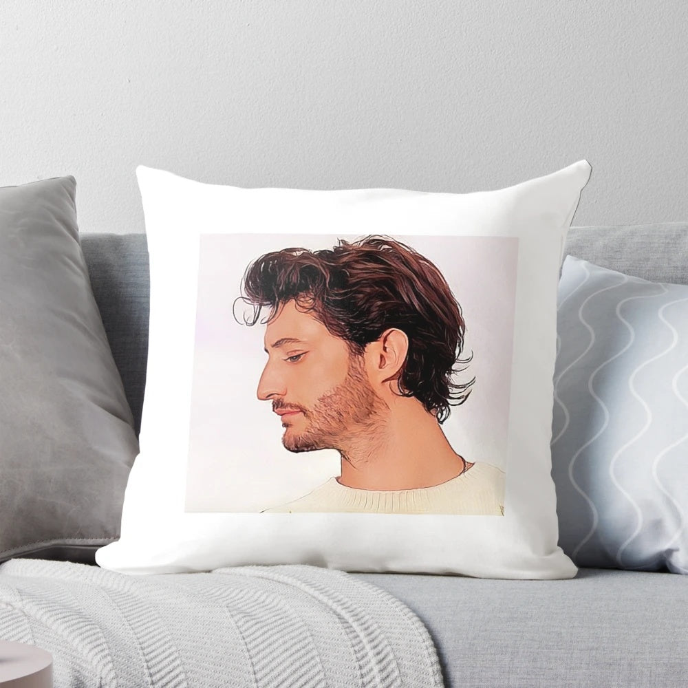 A decorative throw pillow featuring a portrait of French actor Pierre Niney.