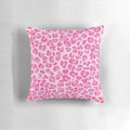 A vibrant pink pillow with a chic leopard print design