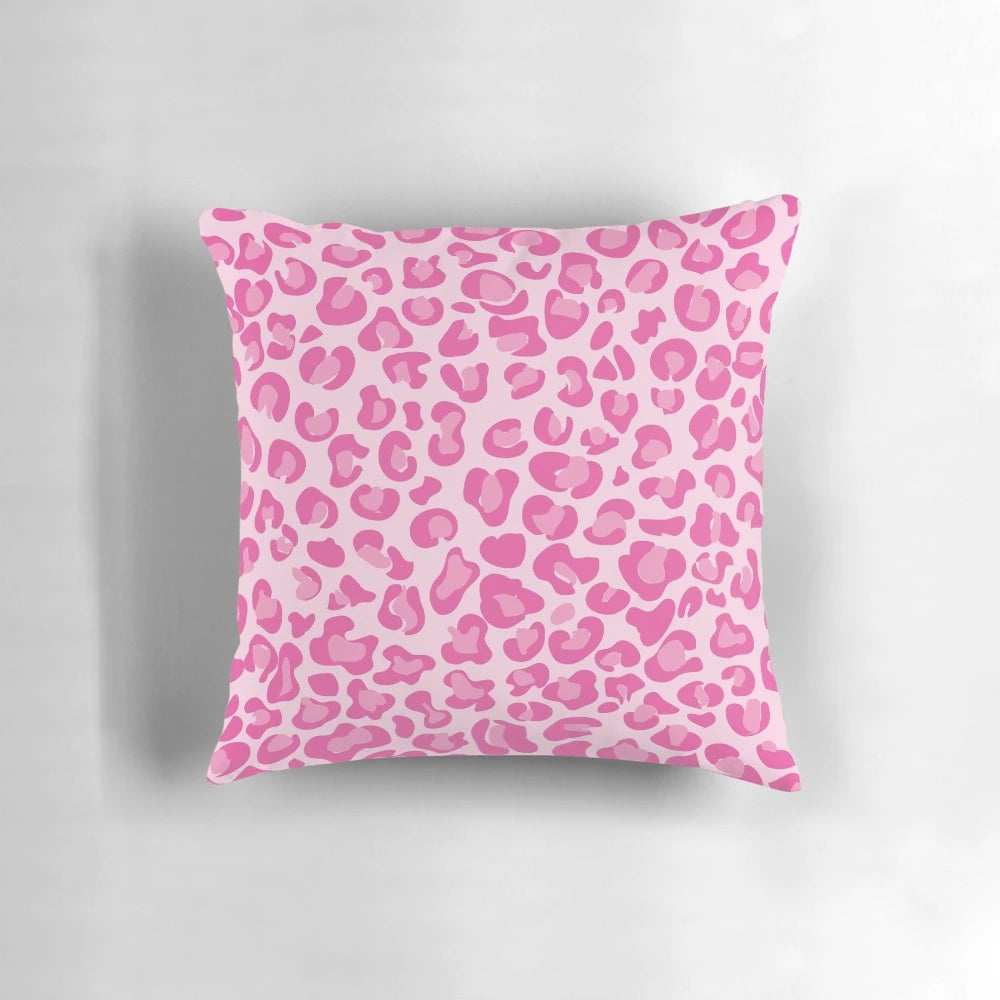 A vibrant pink pillow with a chic leopard print design