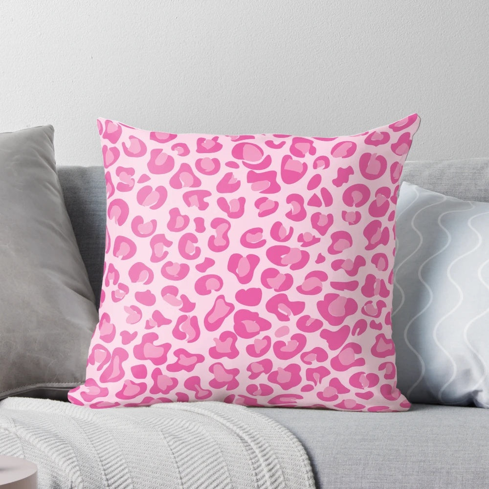 A vibrant pink pillow with a chic leopard print design