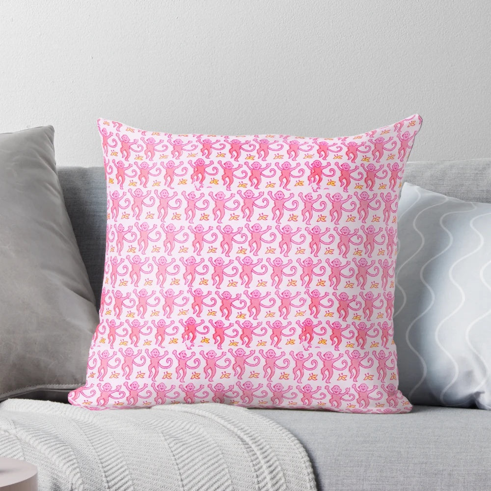 A soft, vibrant pink pillow featuring a whimsical monkey design, perfect for adding a touch of preppy style to any space.