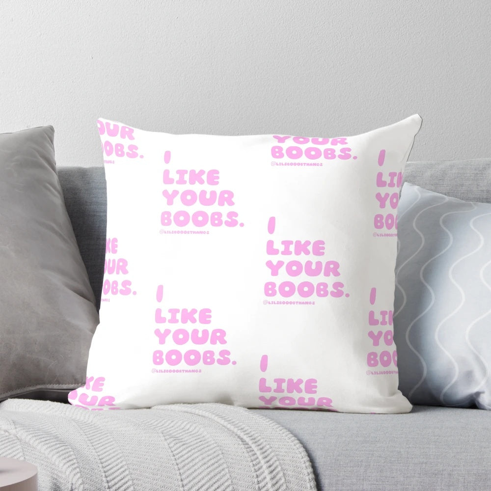 Whimsical pink pillow featuring the phrase "I like your boobs" in a playful font